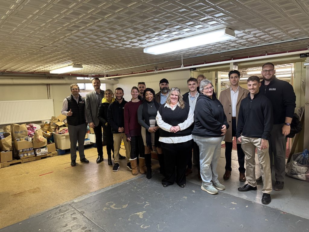 Steet Ponte Auto Group employees at the Thea Bowman House in Utica, NY donating food drive donations