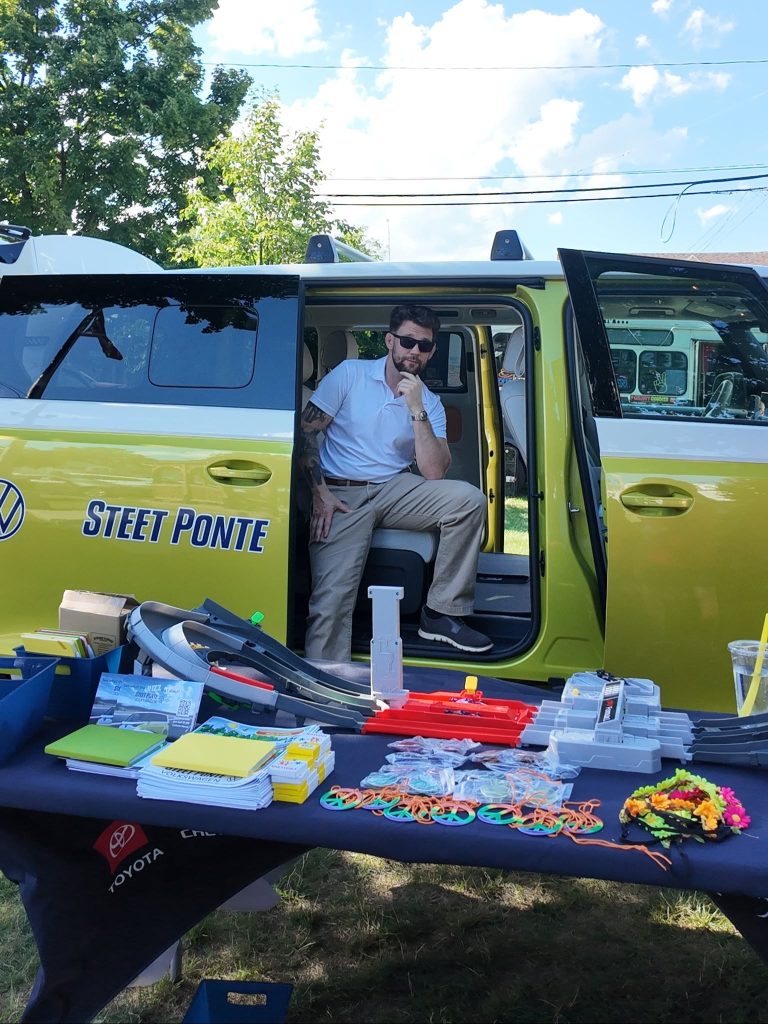 Kyle Kahler at New Hartford Farmer's Market with Steet Ponte VW's VW ID.Buzz