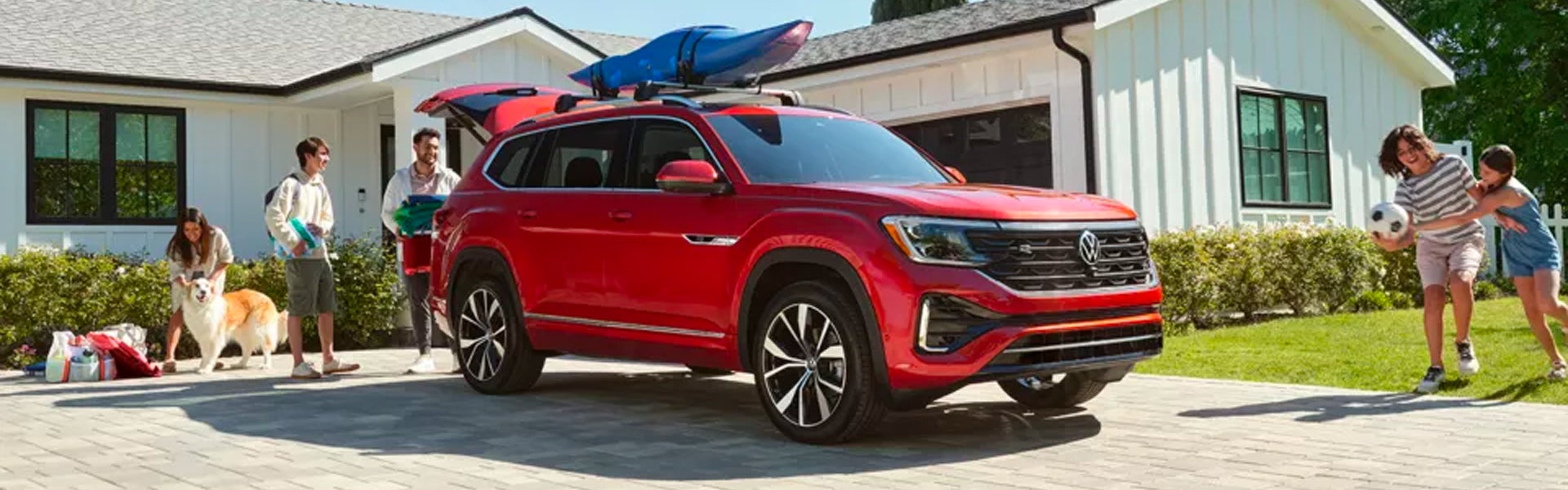 a red 2024 Volkswagen Atlas with view of the front side of vehicle