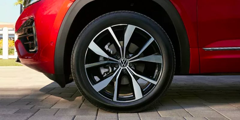the tire of a red 2024 Volkswagen Atlas
